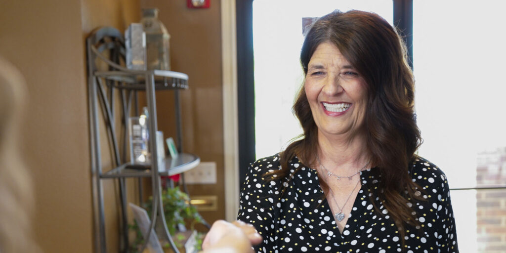 female patient being welcomed in