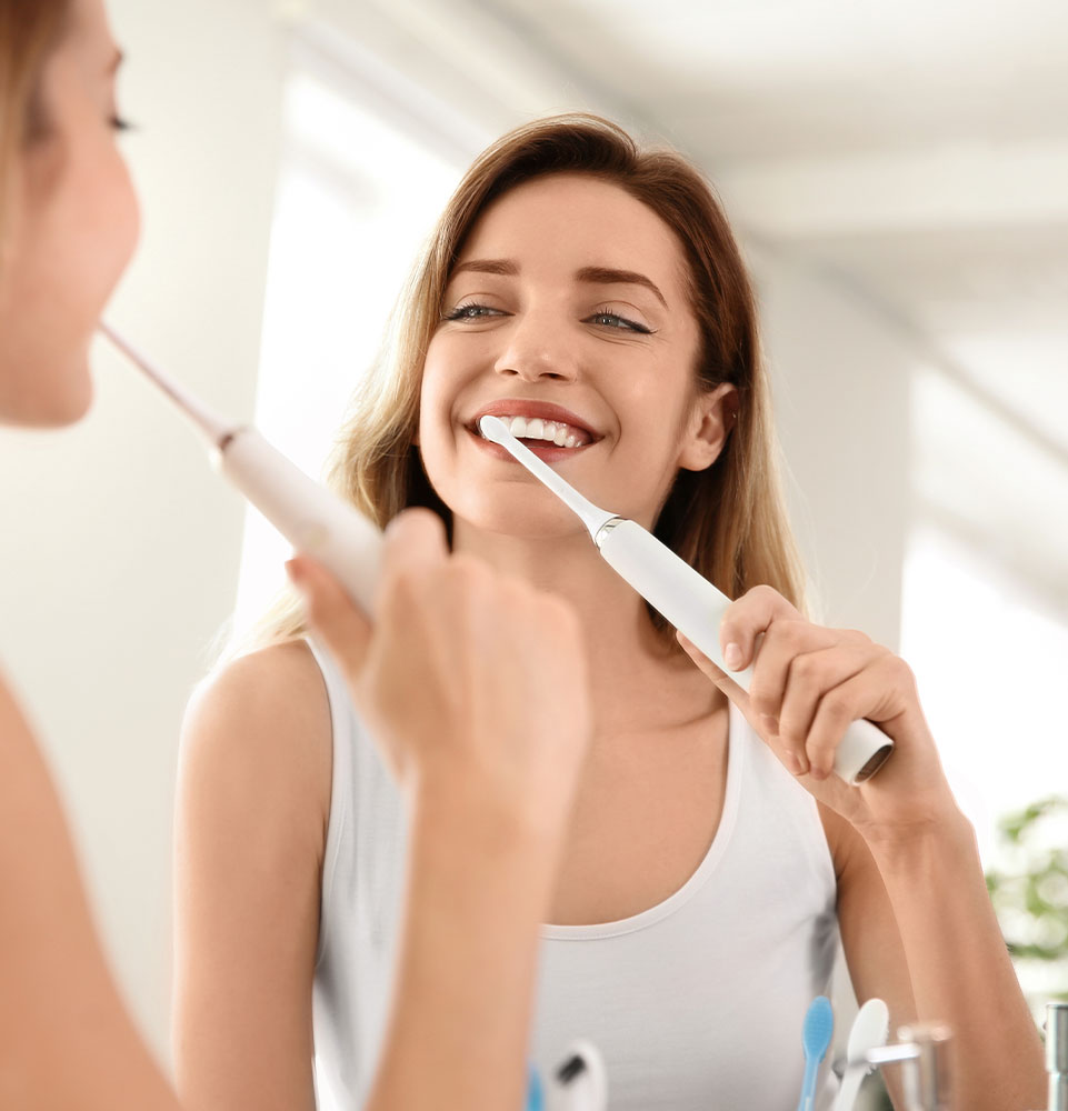 person brushing their teeth