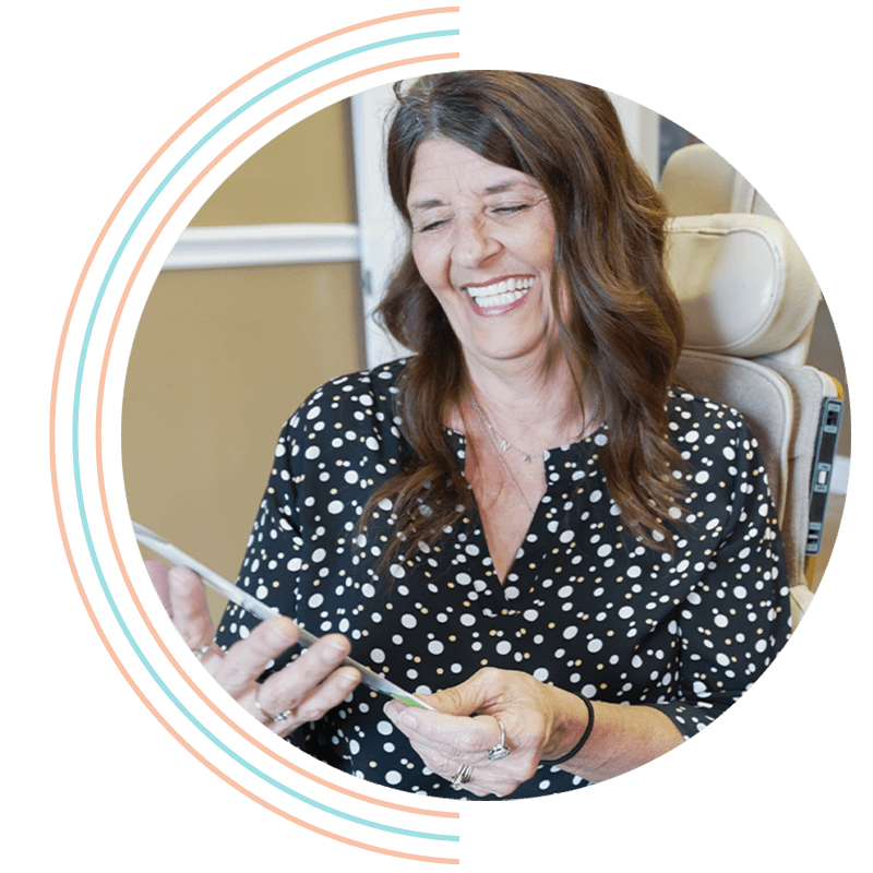 lady excited to learn more on full arch dental implants