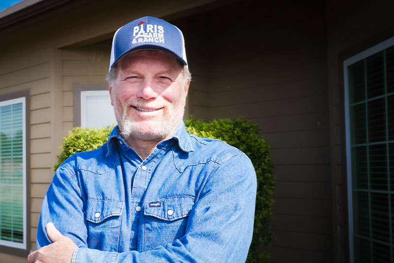 man with ballcap blue shirt dental implants