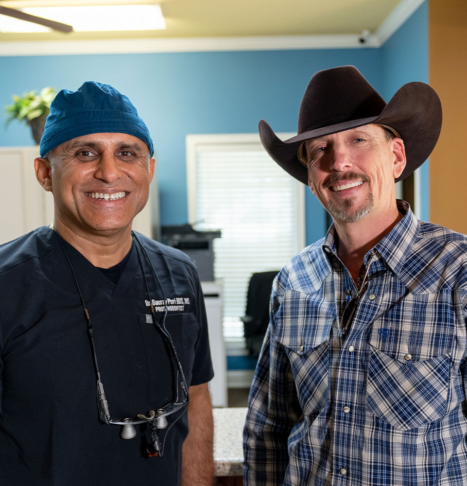 dr puri and man with cowboy hat with his new full arch implants