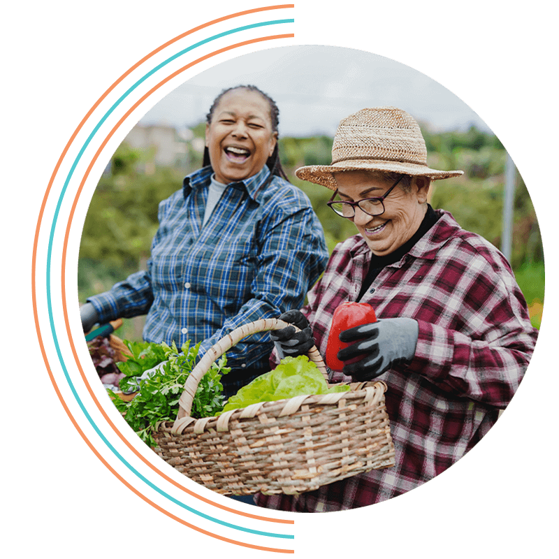 two people doing good picking garden together
